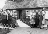 Ladies outside Finden Bungalows - click for full size image