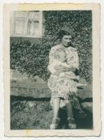 Dorothy Vivien Wray (Ne Breaks) 1908-2002, with her only son Maurice Edward Wray (B-1934) sitting on the 'Bink' or stone seat which was then outside the front of her grandfather's house. - click for full size image